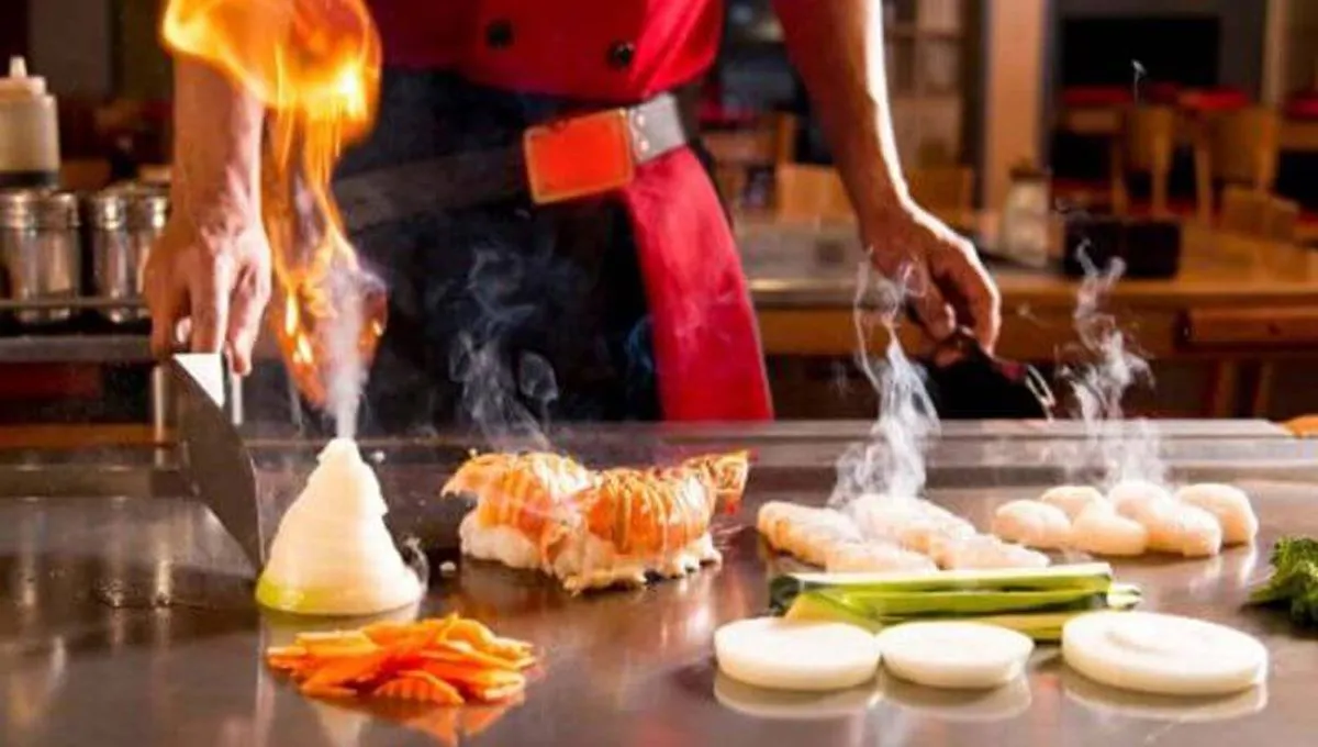 Flaming teppanyaki cooking performance at Hibachi Japanese Steakhouse in Huntington